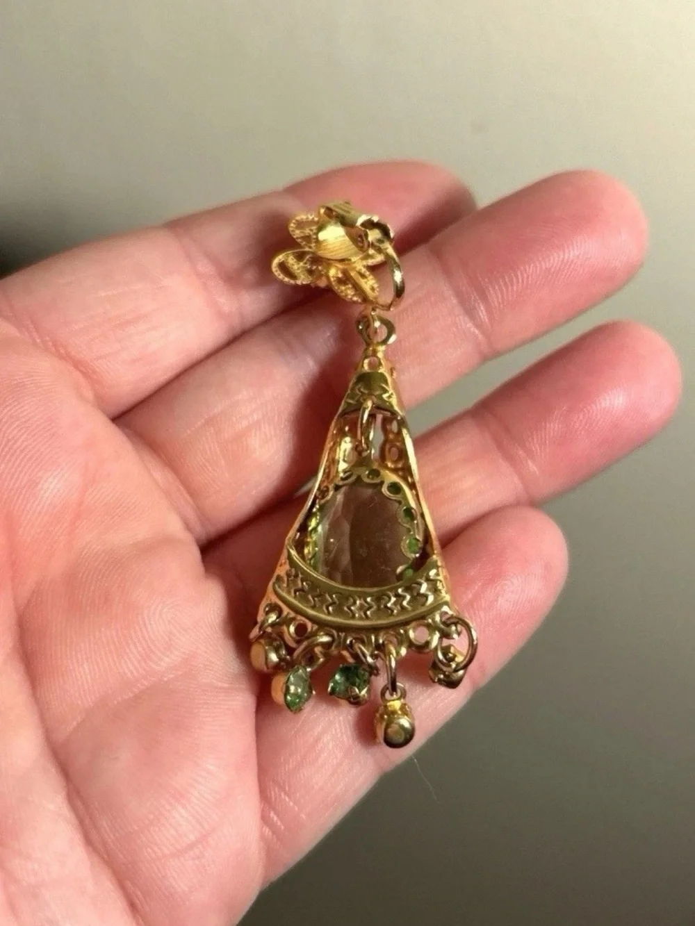 Ornate faceted green glass and gold clip on earrings